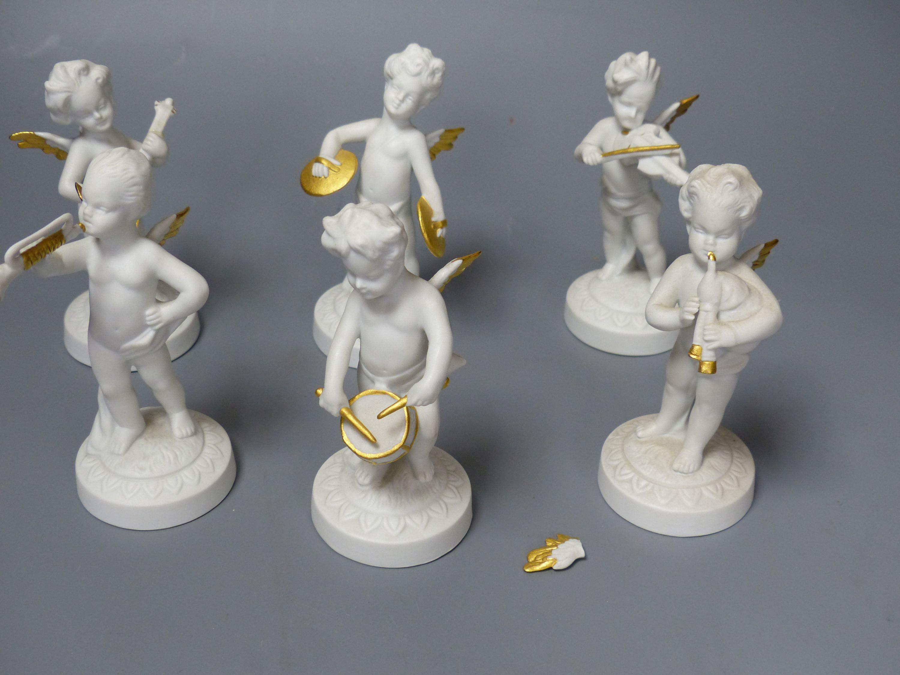 Six Continental porcelain cherubs with musical instruments, tallest 10cm